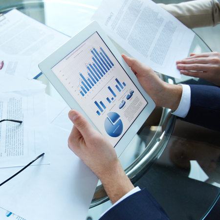 businessman-holding-tablet-with-statistical-data